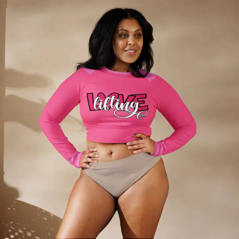 Woman wearing pink recycled long sleeve crop top