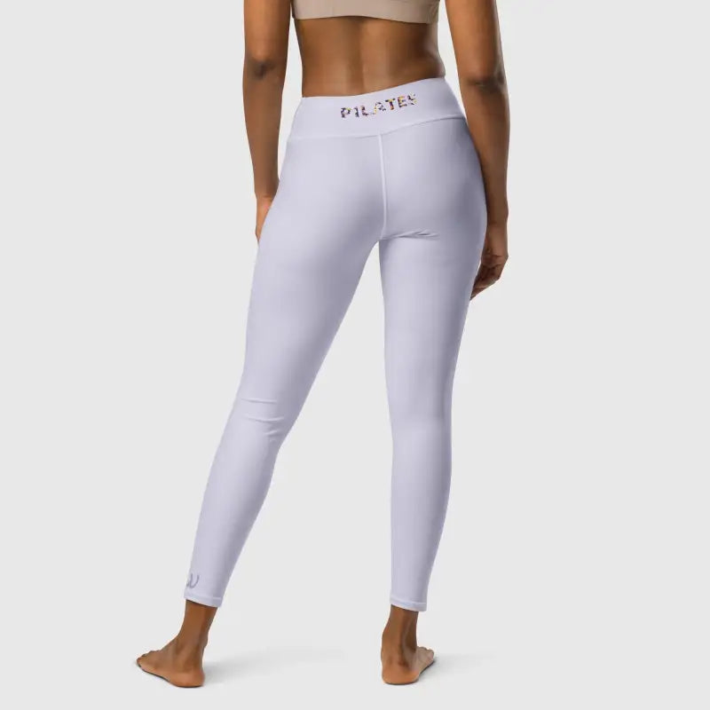 Model wearing light purple pilates high waist leggings