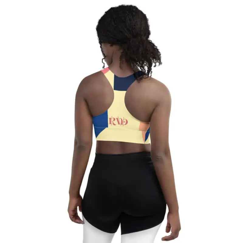 Active abstract padded sports bra with yellow, blue, pink color blocking for workout gear