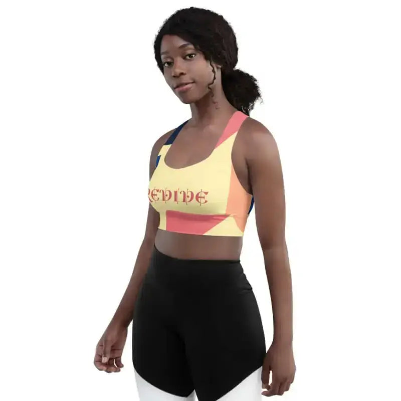 Yellow and coral active abstract sports bra with black workout leggings for fitness fun