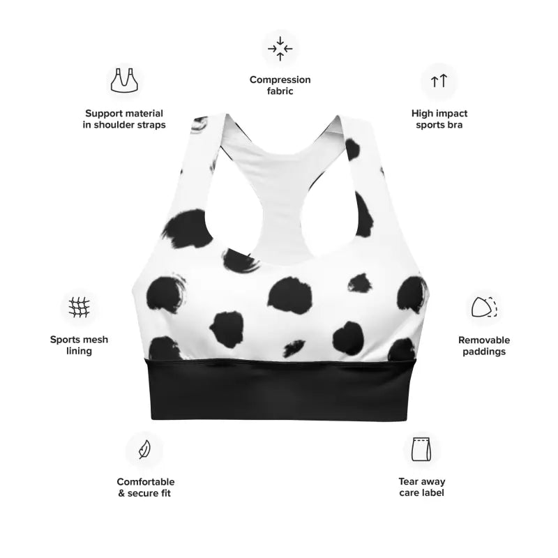 White and black polka dot longline sports bra with labeled features for active wear