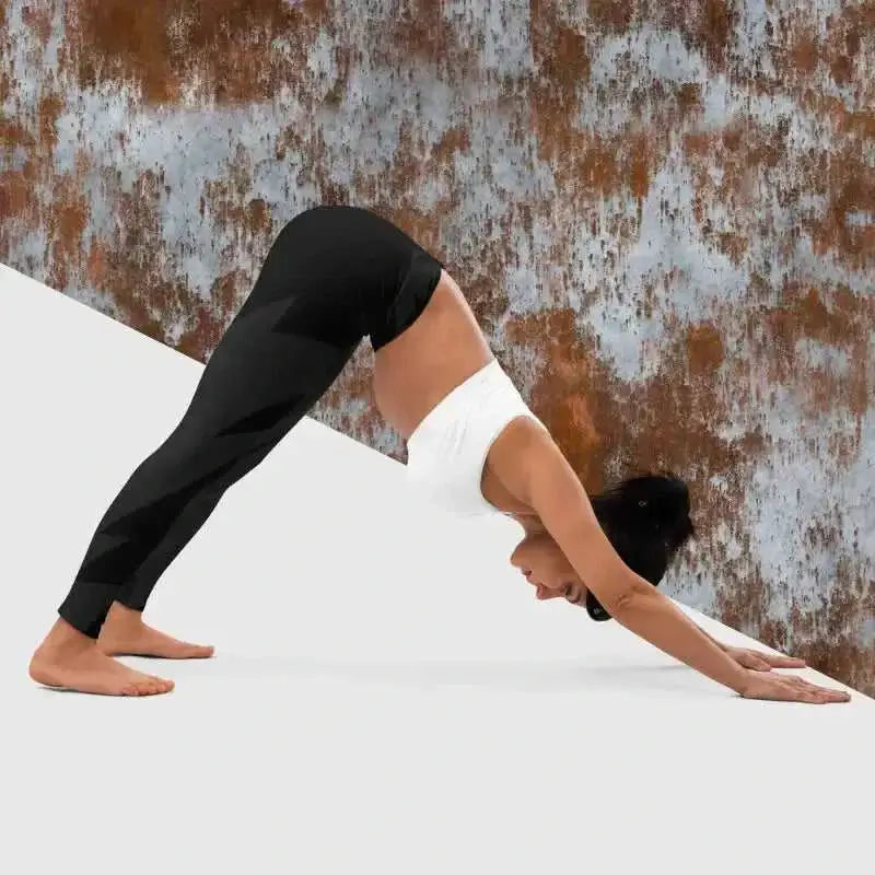 Person doing downward-facing dog in black yoga leggings, perfect for black yoga and yoga leggings