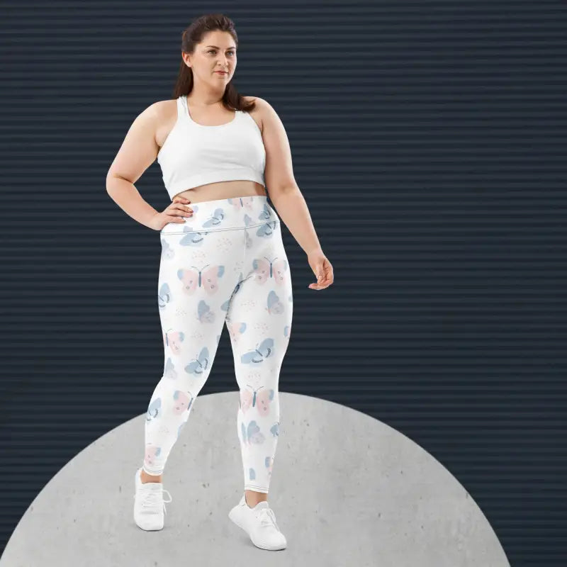 Woman in white butterfly-patterned plus size high waist gym leggings from Bliss Australia