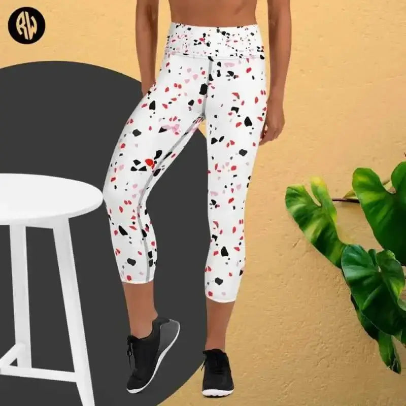 White capri leggings with red and black splatter pattern, perfect for yoga wear