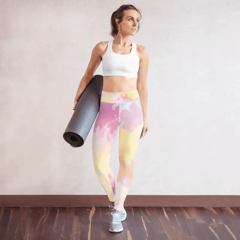 Woman wearing pastel high waisted tie-dye yoga leggings for comfortable workout style