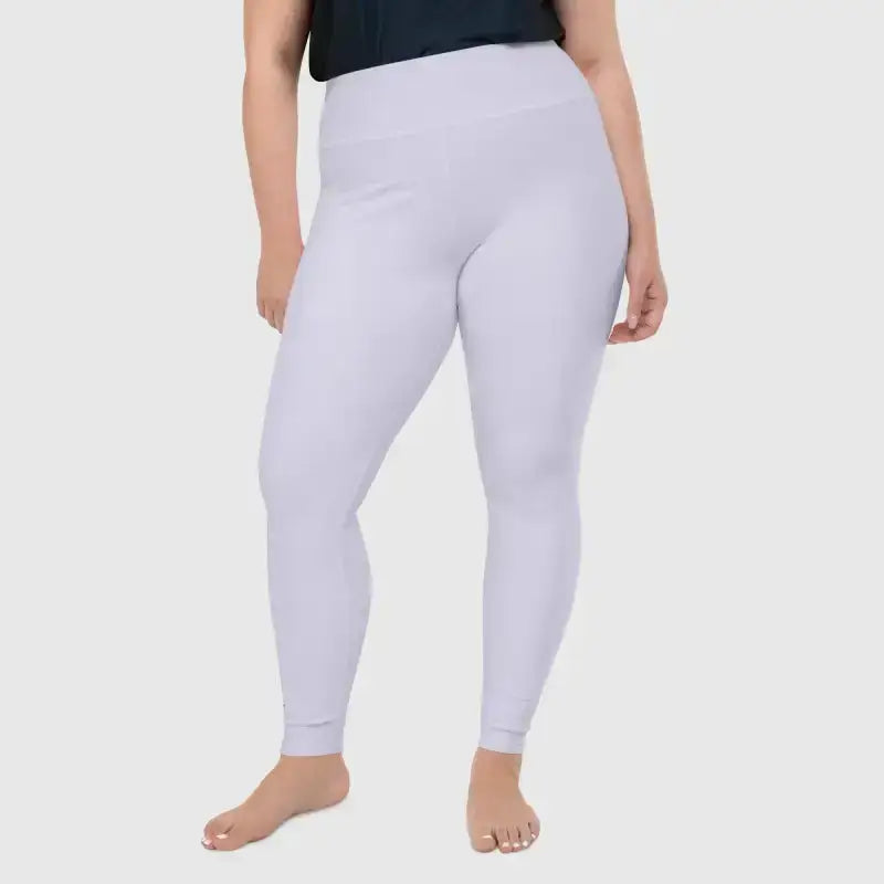 Model wearing light purple plus size Pilates leggings, showcasing comfort and fit for workouts.
