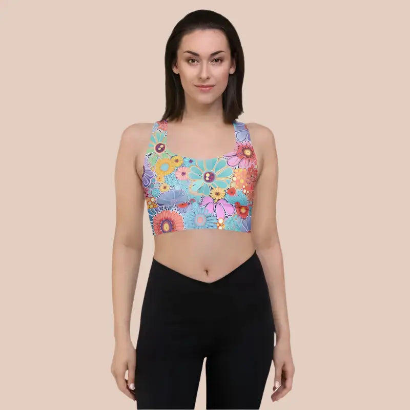 Model wearing recycled longline sports bra in a pretty flower print design.