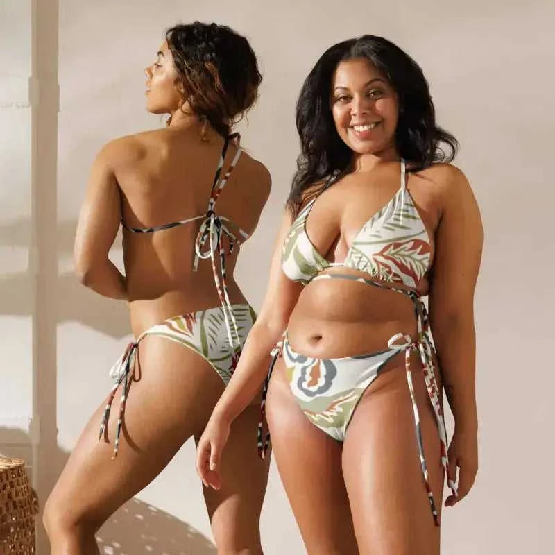 Two women wearing matching floral print string bikini swimwear set perfect for summer fun