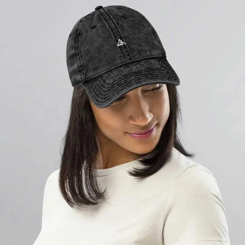 Distressed black vintage cotton twill baseball cap with embroidered logo and washed out look