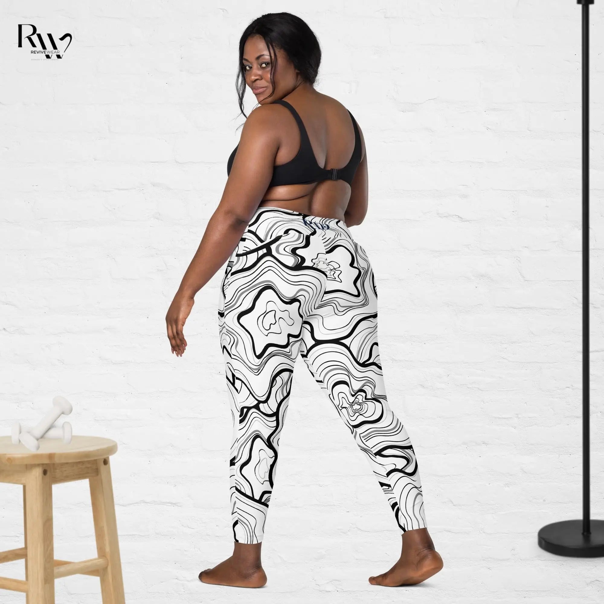 Model wearing radiant plus size leggings from Revive Wear