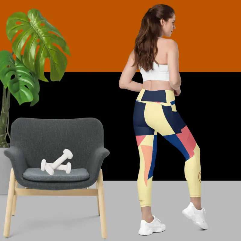 Colorful geometric abstract pocket leggings in yellow, blue, pink, and navy