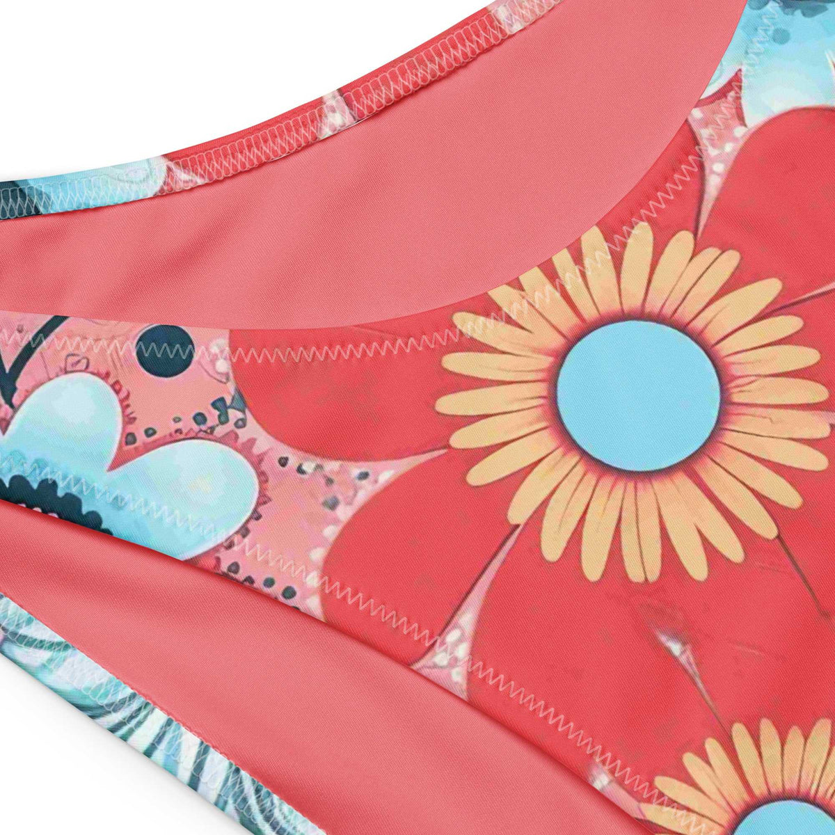 Close-up of bandeau bikini fabric made with floral patterns on a white background