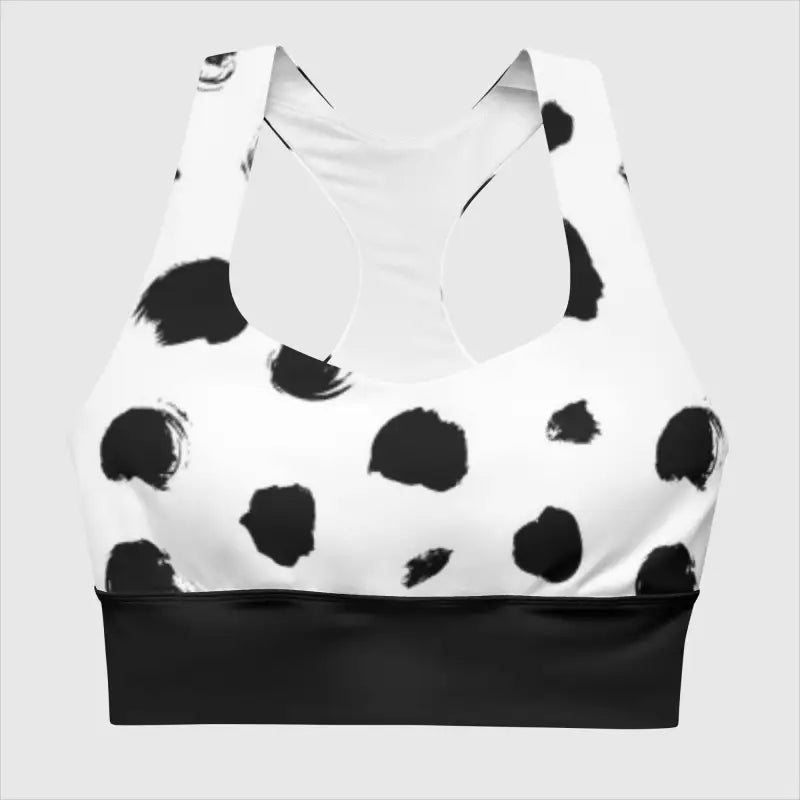 Black and white longline sports bra with polka dots and a black band for stylish support