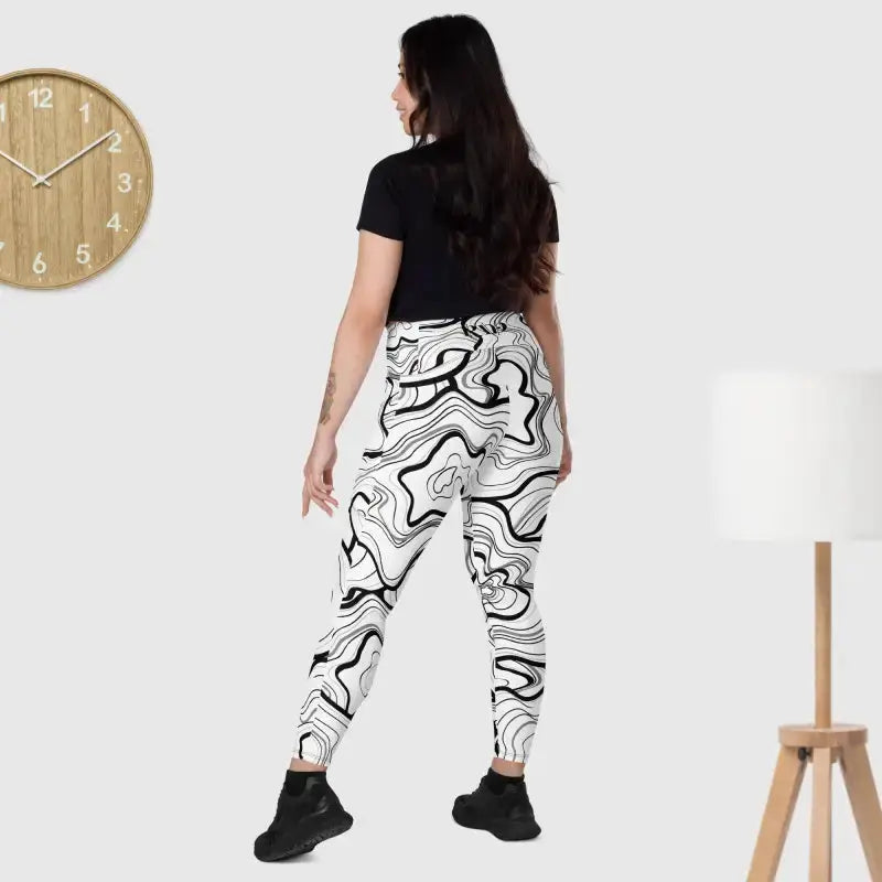 White jogger pants with black swirl pattern and black fitness leggings for stylish workouts