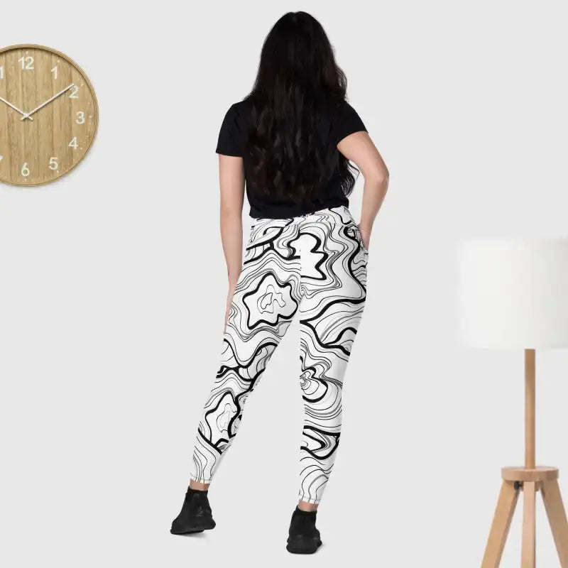 White jogger pants with a black topographic pattern, perfect for black fitness leggings style