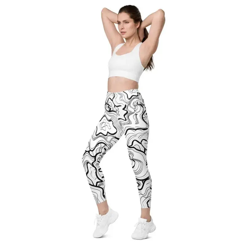 Stylish black fitness leggings with a swirl pattern and phone pocket for workouts