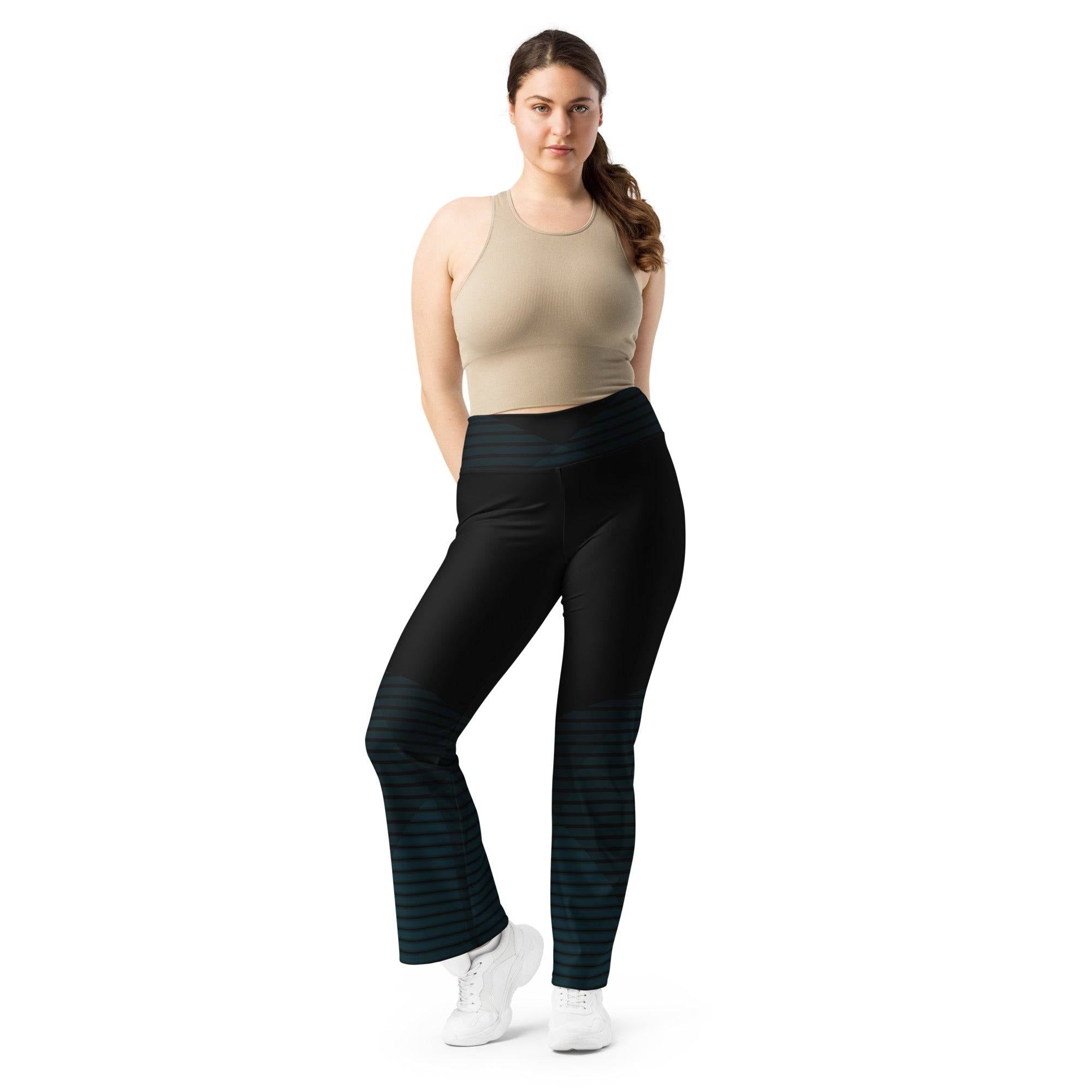 Model wearing Black Flare Leggings. Revive Wear's curve-hugging black flared leggings feature an on-trend flared cut that lifts and shapes. Shop from small to plus sizes with free shipping.