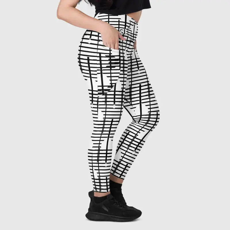 Black recycled crossover leggings with bold geometric grid pattern perfect for style and comfort
