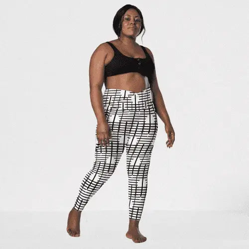 Black Recycled Crossover Leggings with Pockets - Revive Wear     Plus Size Black Recycled Leggings with Pockets. Comfortable plus size leggings with pockets made from recycled materials. Stylish women's activewear.  
