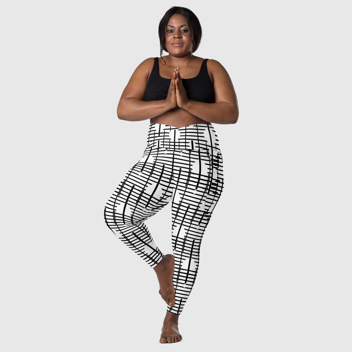 Black Recycled Crossover Leggings with Pockets - Revive Wear     Plus Size Black Recycled Leggings with Pockets. Comfortable plus size leggings with pockets made from recycled materials. Stylish women&#39;s activewear.  
