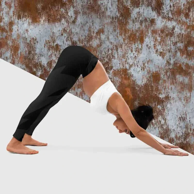 Person doing downward-facing dog in black yoga leggings, perfect for black yoga and yoga leggings