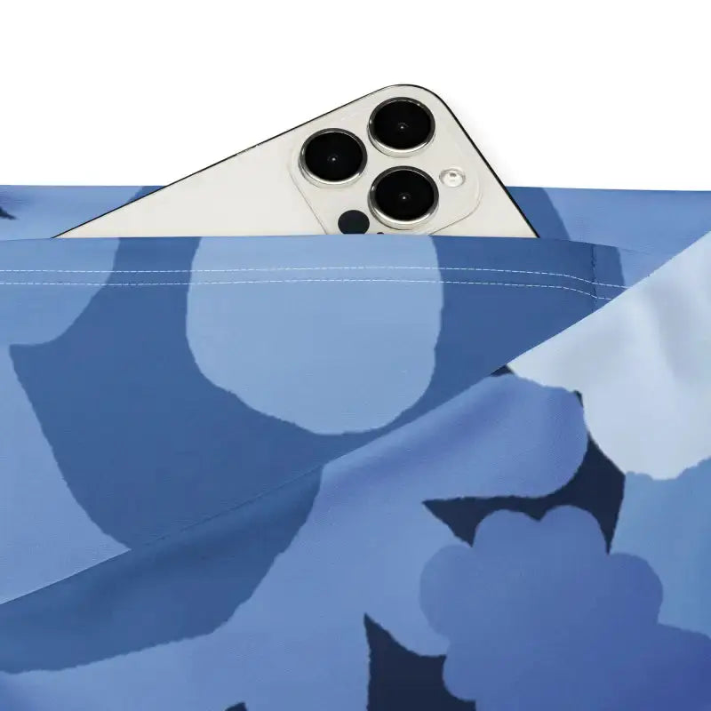 Blue floral flare leggings with butt-lifting cut showing phone in pocket for hands-free convenience