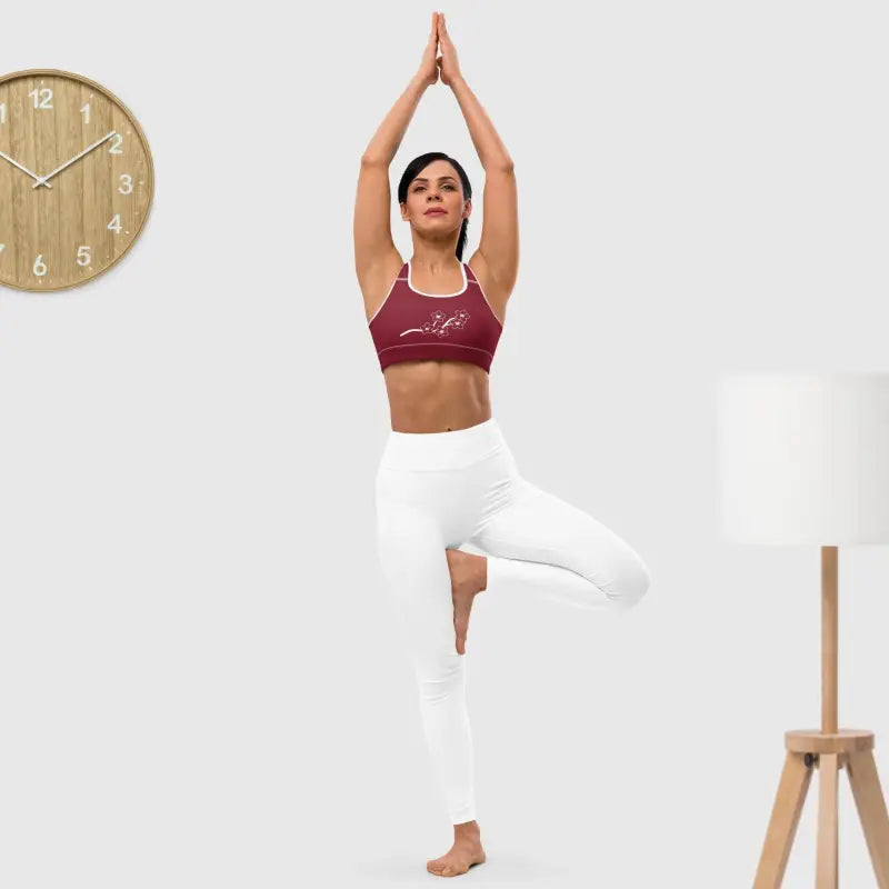 Woman in yoga pose wearing a Floral Padded Sports Bra for medium support and style