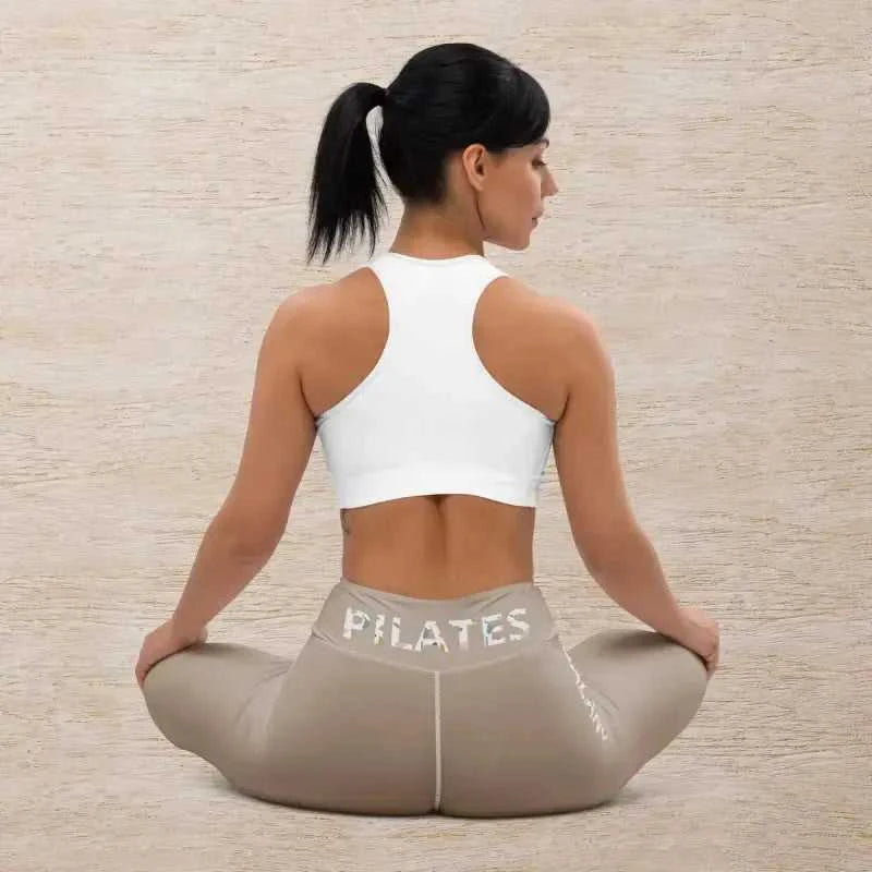 Woman in stylish khaki Pilates leggings, ready for her workout session