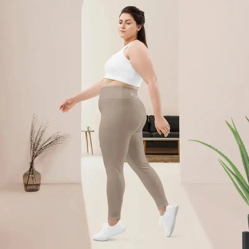 Woman in beige high waistband Pilates leggings with stretch fabric for comfort