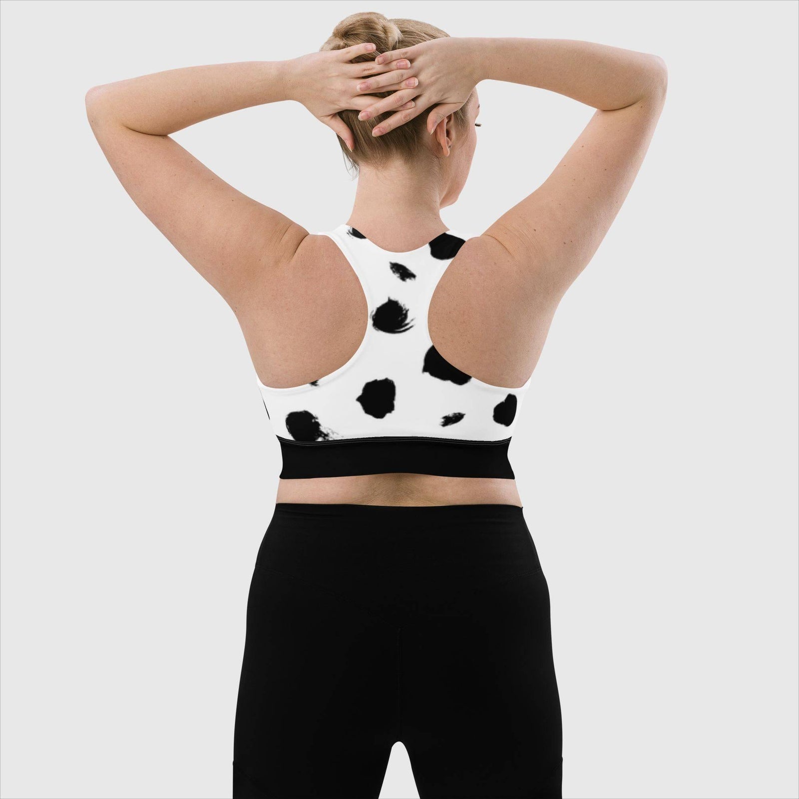 Black and White Longline Sports Bra - Revive Wear     Stay comfortable and confident during any workout with our Longline Sports Bra. Made with a supportive fit and moisture-wicking fabric, this bra is perfect for any level of intensity.