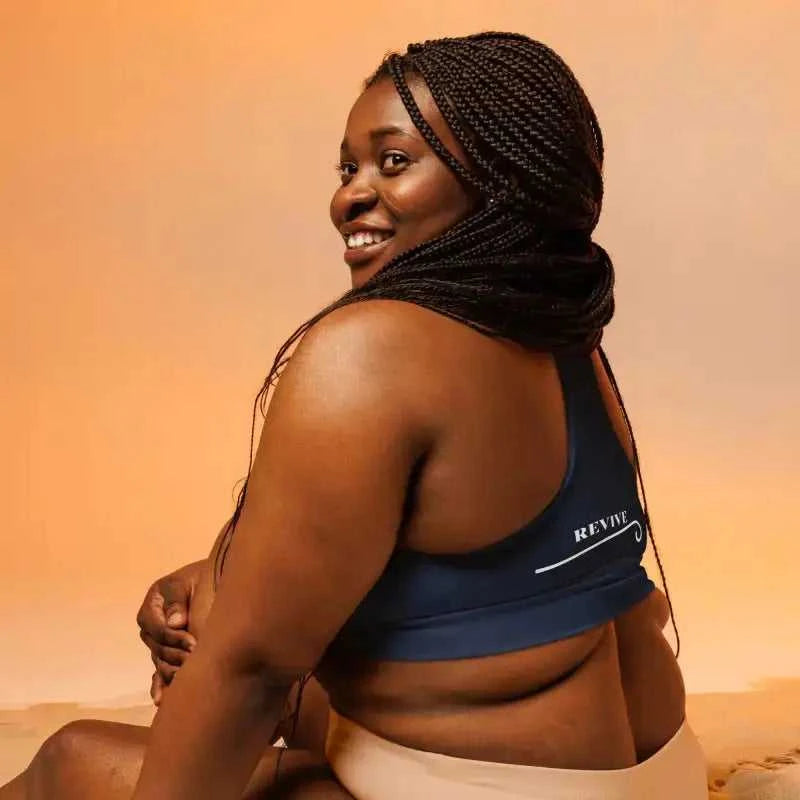 Smiling person in Navy Recycled Longline Sports Bra, perfect plus size activewear