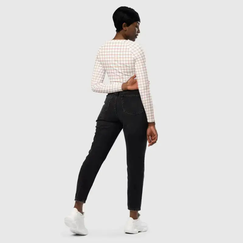 Woman in black jeans and checkered top featuring pinstripe recycled long-sleeve crop
