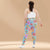 Back view of model wearing plus size flower activewear leggings