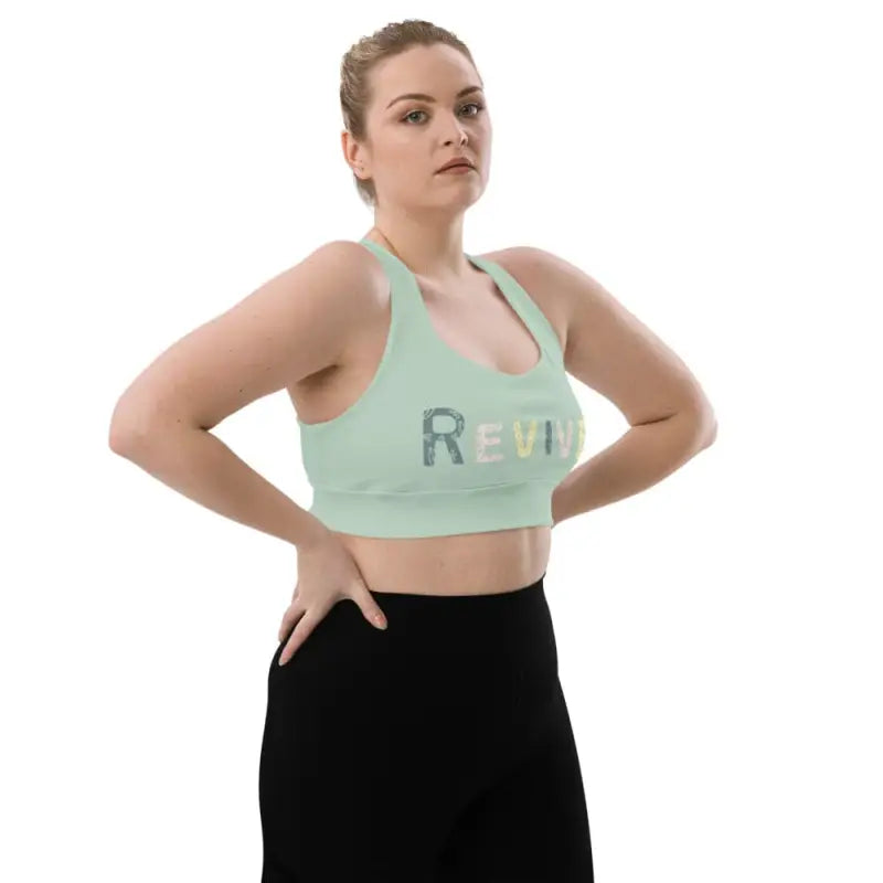Woman wearing Revive Longline Sports Bra in Ocean Green, a comfy longline sports bra perfect for workouts