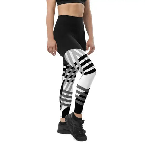 Sports Leggings with Phone Pocket in Black and White Print - Revive Wear Enhance your workouts with Revive Wear AU's Sports Leggings featuring a convenient phone pocket. Stay connected and stylish during your fitness routine. Shop now!