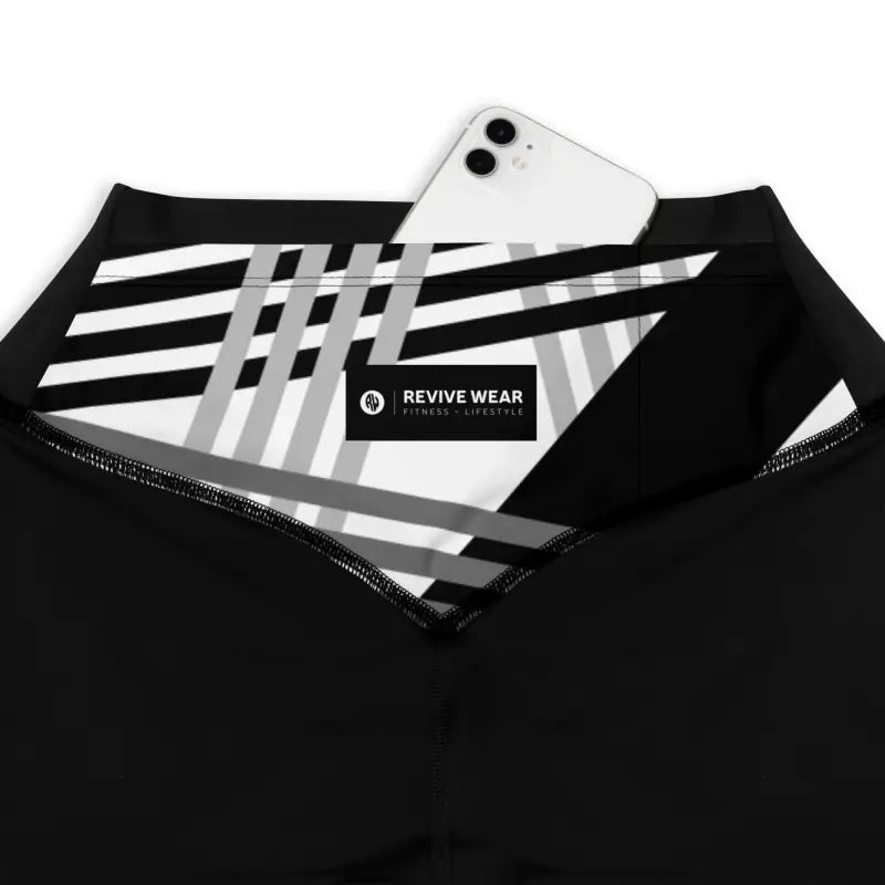 Product features of Sports Leggings with Phone Pocket in Black and White Print - Revive Wear Enhance your workouts with Revive Wear AU's Sports Leggings featuring a convenient phone pocket. Stay connected and stylish during your fitness routine. Shop now!