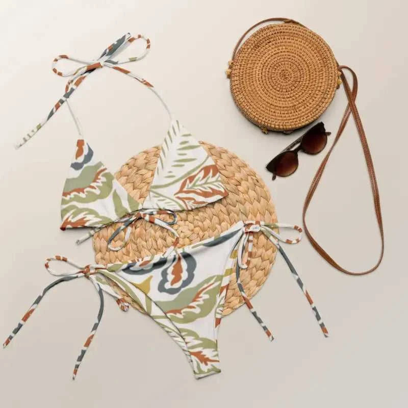 Patterned string bikini swimwear set with round bag and sunglasses for beach style