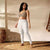 Woman in plaid leggings and sports bra showing off striped yoga leggings with four-way stretch fabric