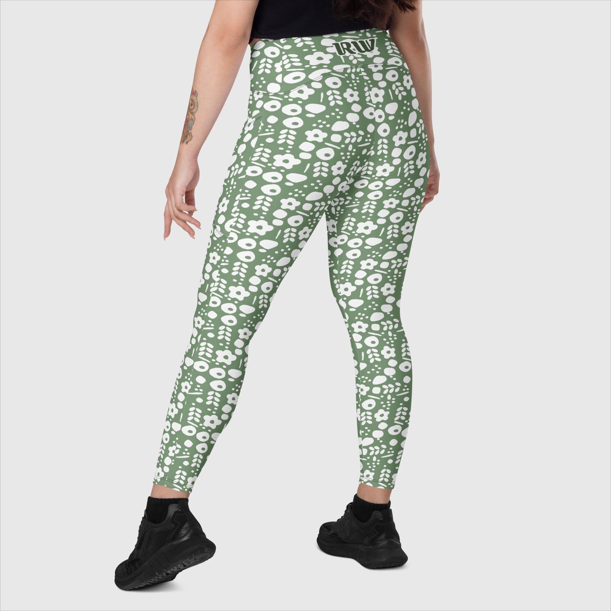 Women's recycled leggings with side pockets in a green and white pattern.