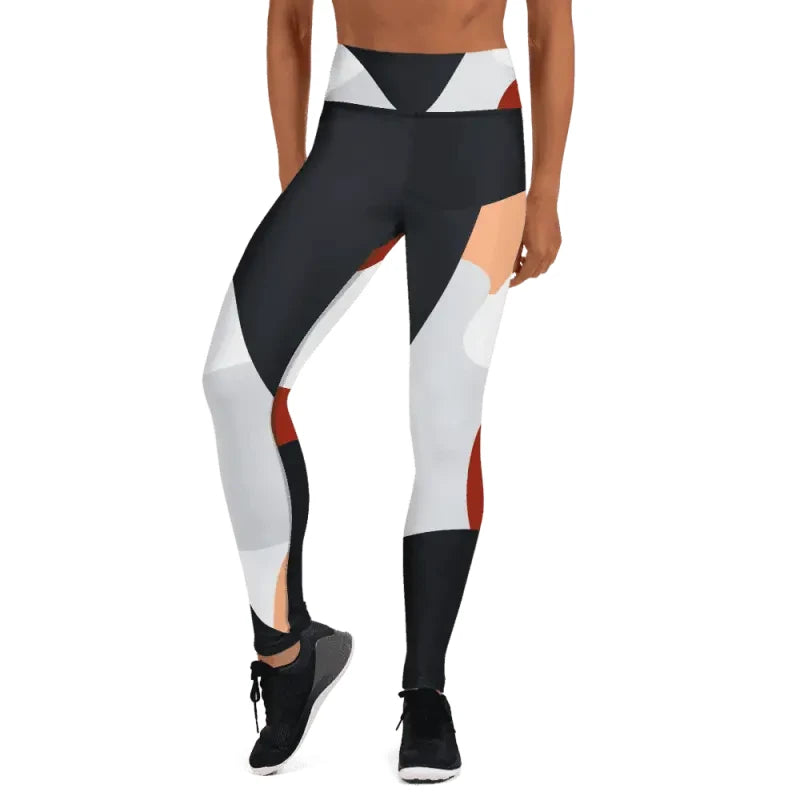 Athletic leggings in a geometric black, white, and red color-block design for workouts