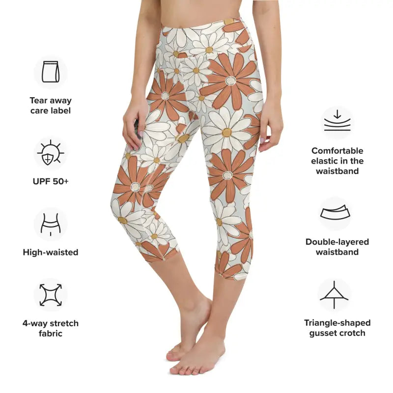 High-waisted capri leggings with orange and white floral print.