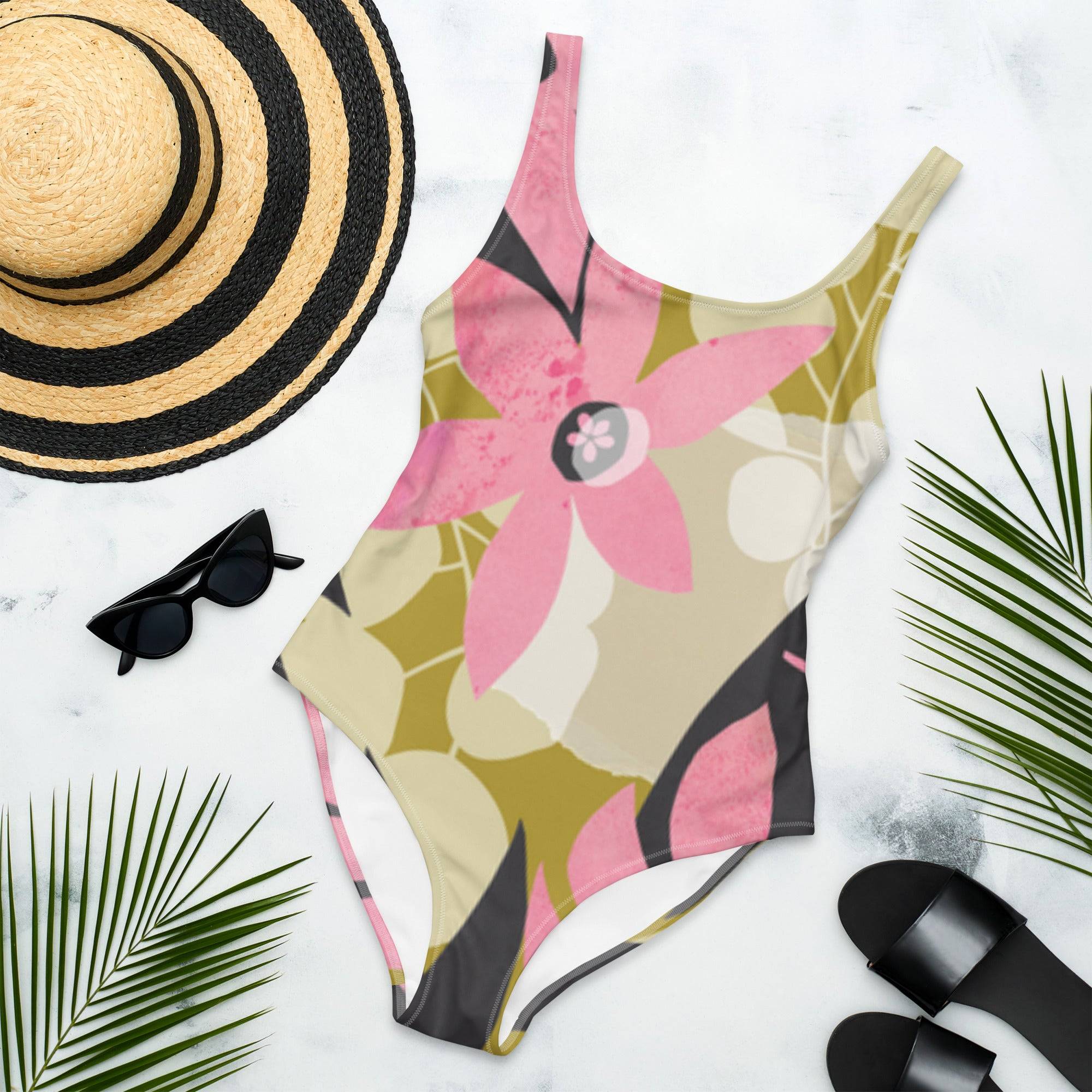 Floral One-Piece Swimsuit | Cheeky One Piece Swimwear - Revive Wear     Cheeky One Piece Swimwear. Floral design with a low back and cheeky cut. Shop Sportswear Accessories for swimsuits, hats, and sports headbands.