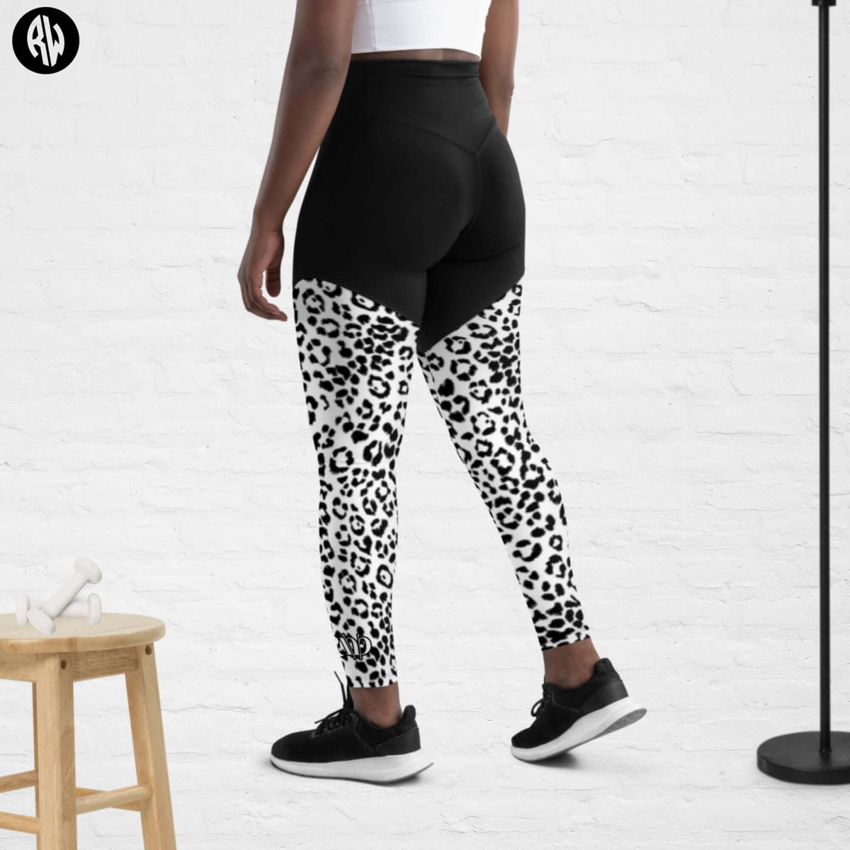 Sports Leggings with Phone Pocket in Black and White Print - Revive Wear     Enhance your workouts with Revive Wear AU&#39;s Sports Leggings featuring a convenient phone pocket. Stay connected and stylish during your fitness routine. Shop now!