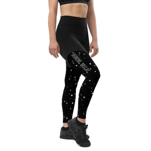 Woman wearing black sports leggings with pocket for storing iphone